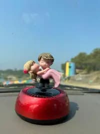 solar powered car dashboard figurine